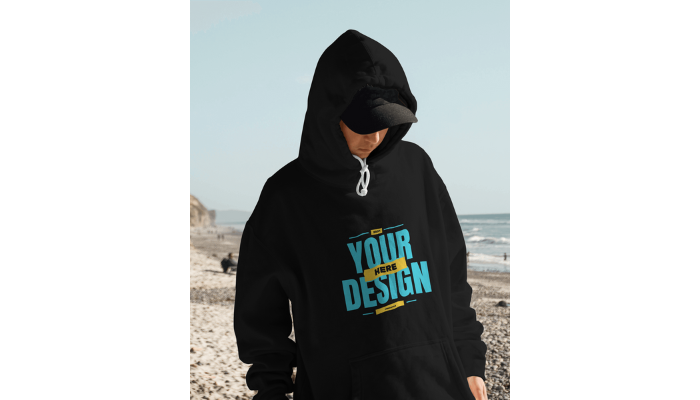 boy with a black hoodie at beach