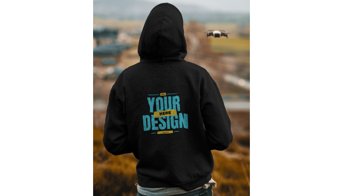 young boy flying drone in hoodie template black