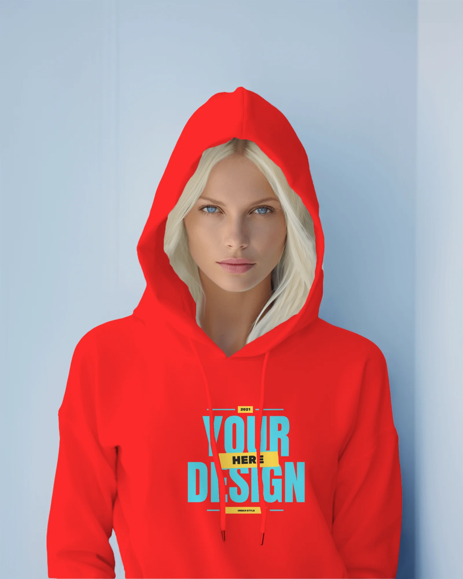 Woman wearing red hoodie mockup in front of blue gray wall