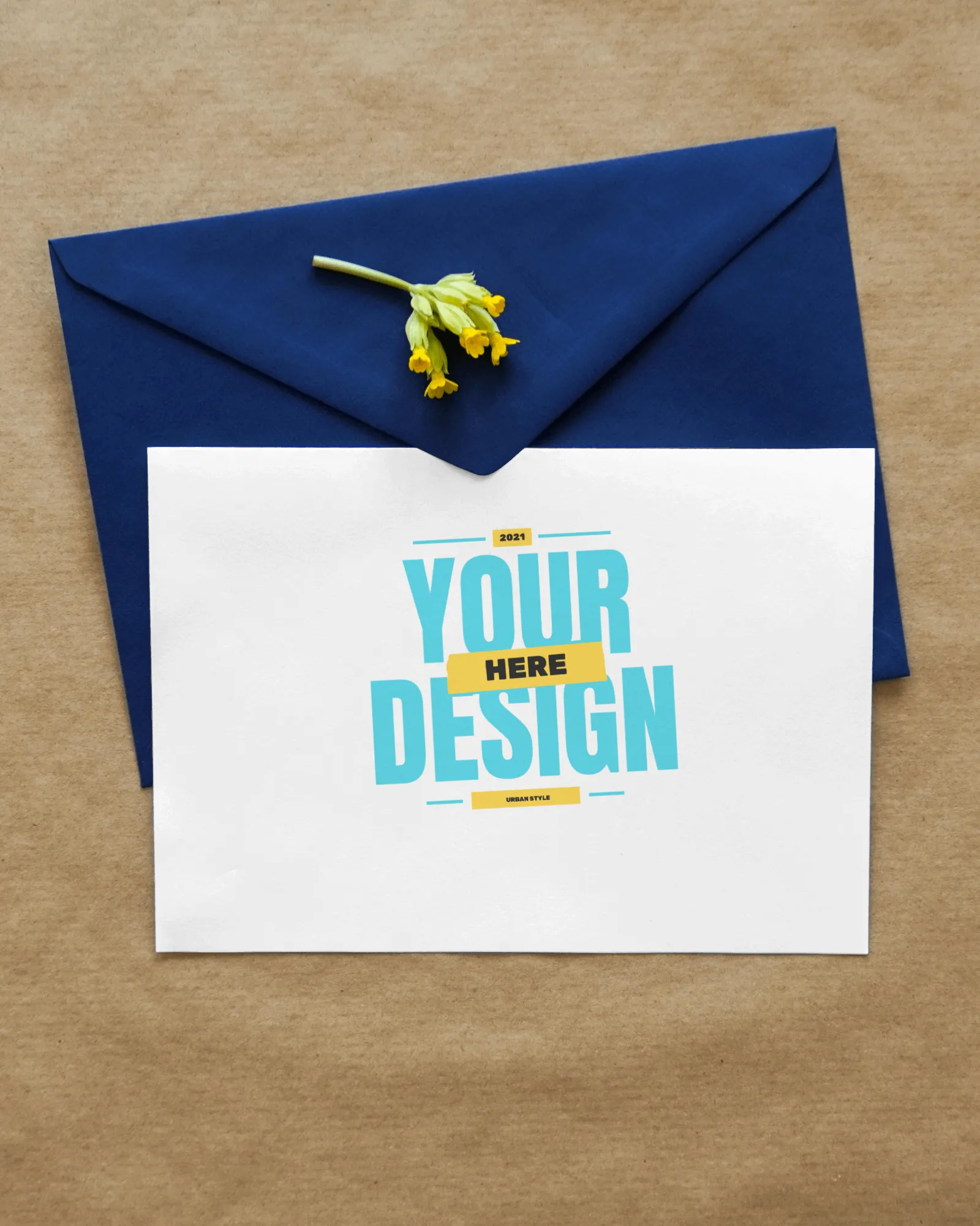 greeting card mockup enclosed in an envelope with flower lying on it 