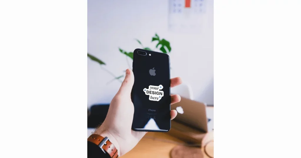 a mock-up of a sticker on an iPhone being held