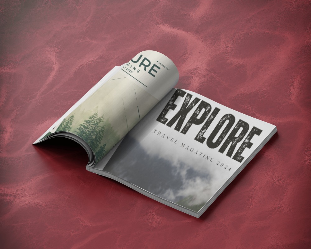 folded-magazine-mockup-showcasing-inner-pages-on-rich-red-surface