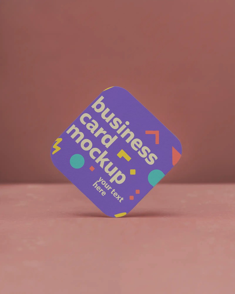 diamond oriented business card mockup on textured red surface with straight soft light focus








