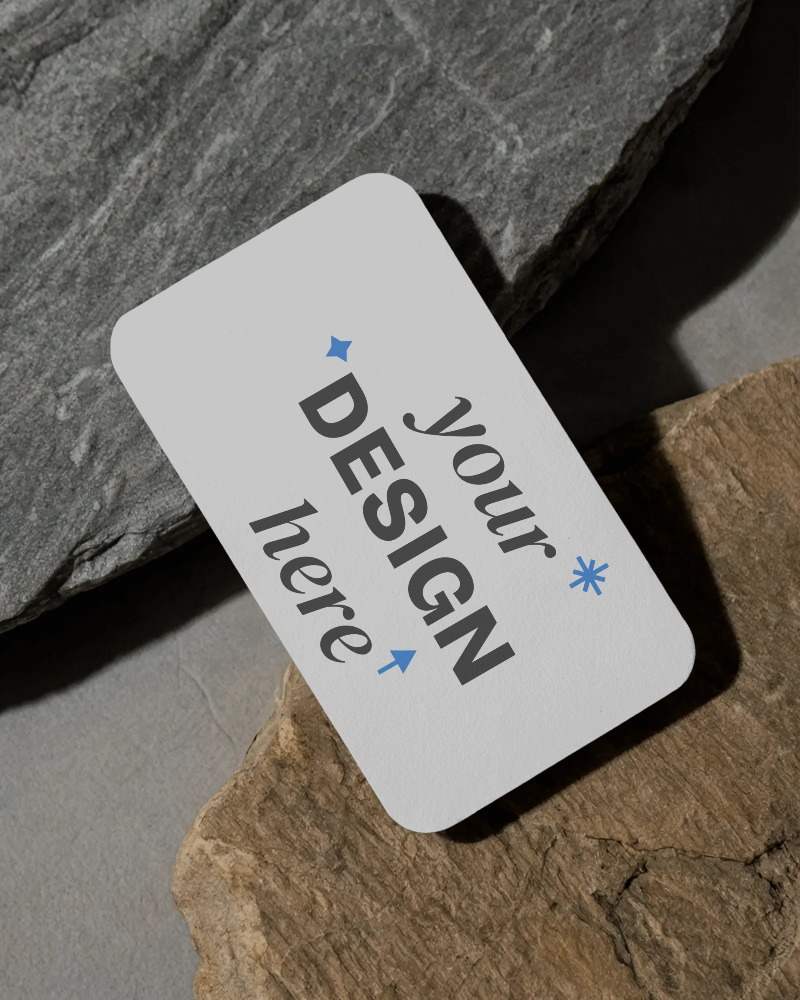 textured stone surface business card mockup with rounded corners and rustic minimal backdrop









