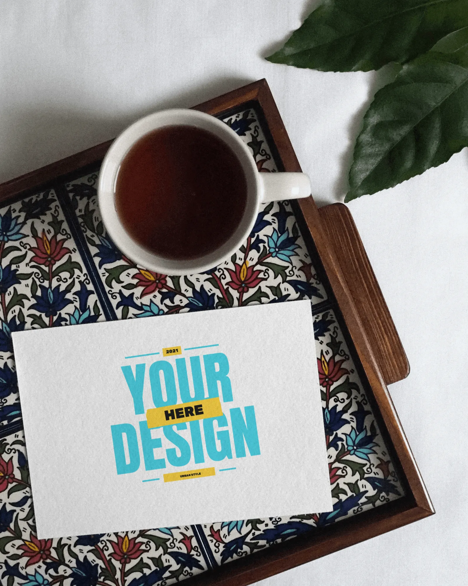 greeting card mockup on a tray beside coffee 