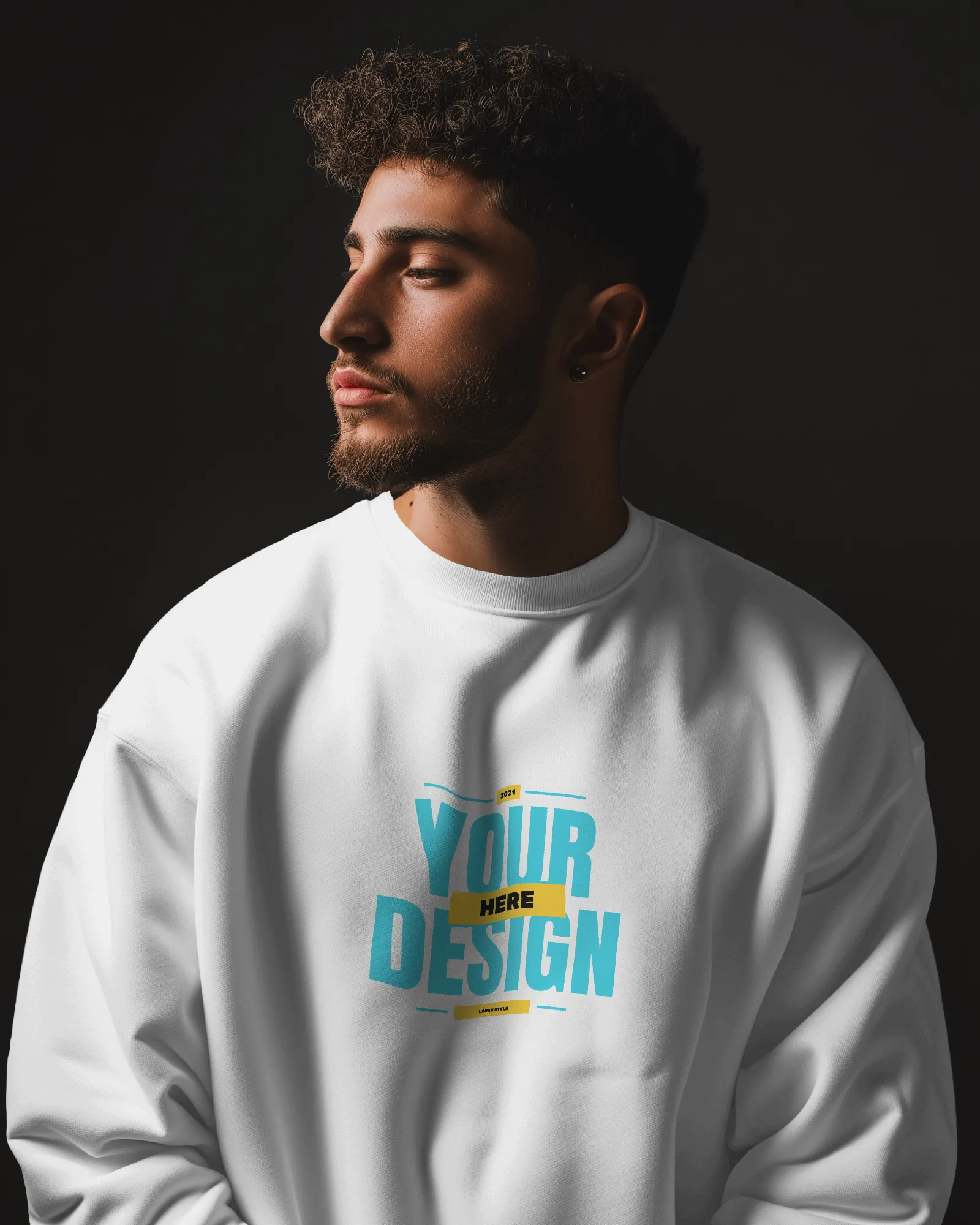 man wearing sweatshirt mockup in dark studio