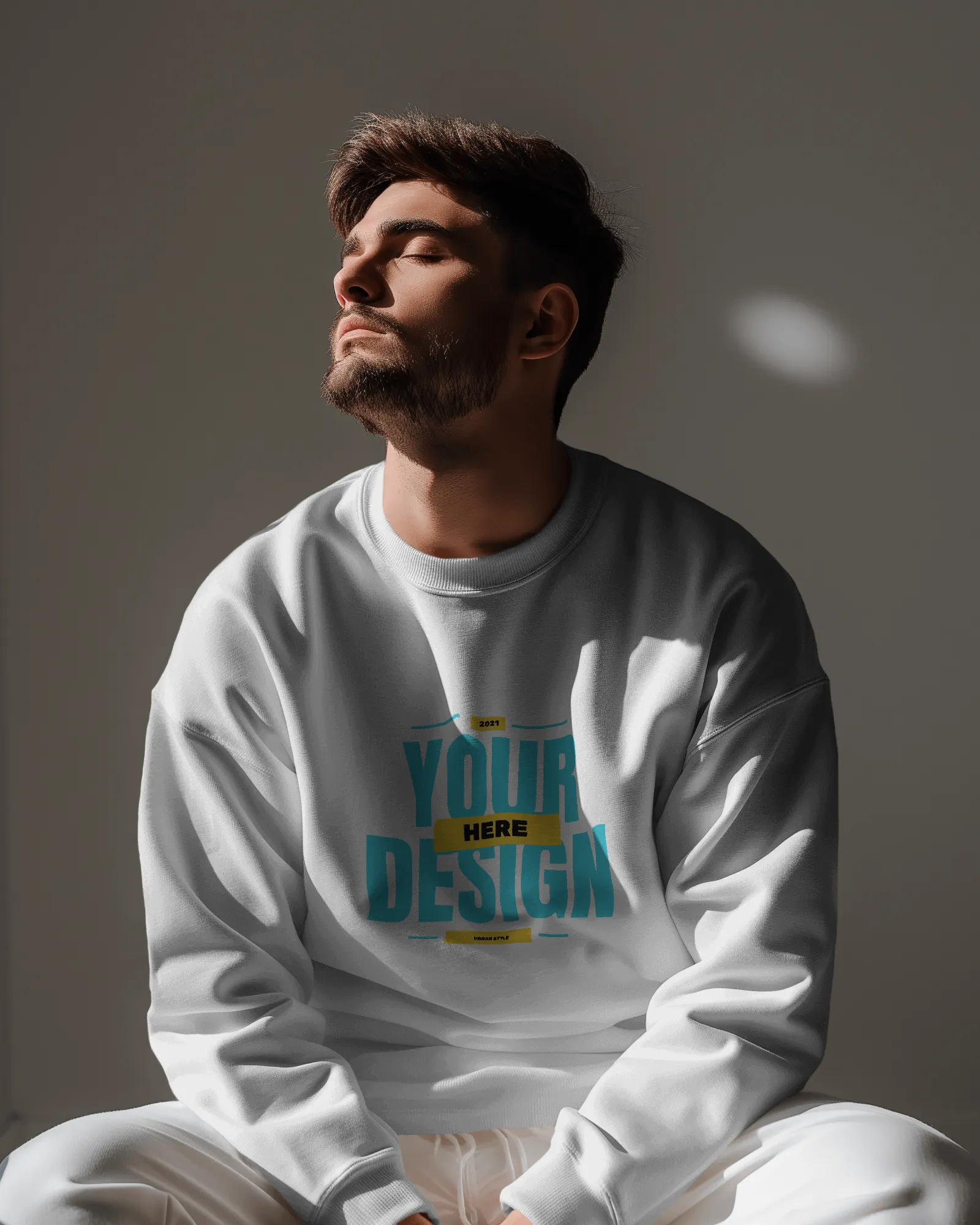 man wearing sweatshirt mockup in sunlight with eyes closed