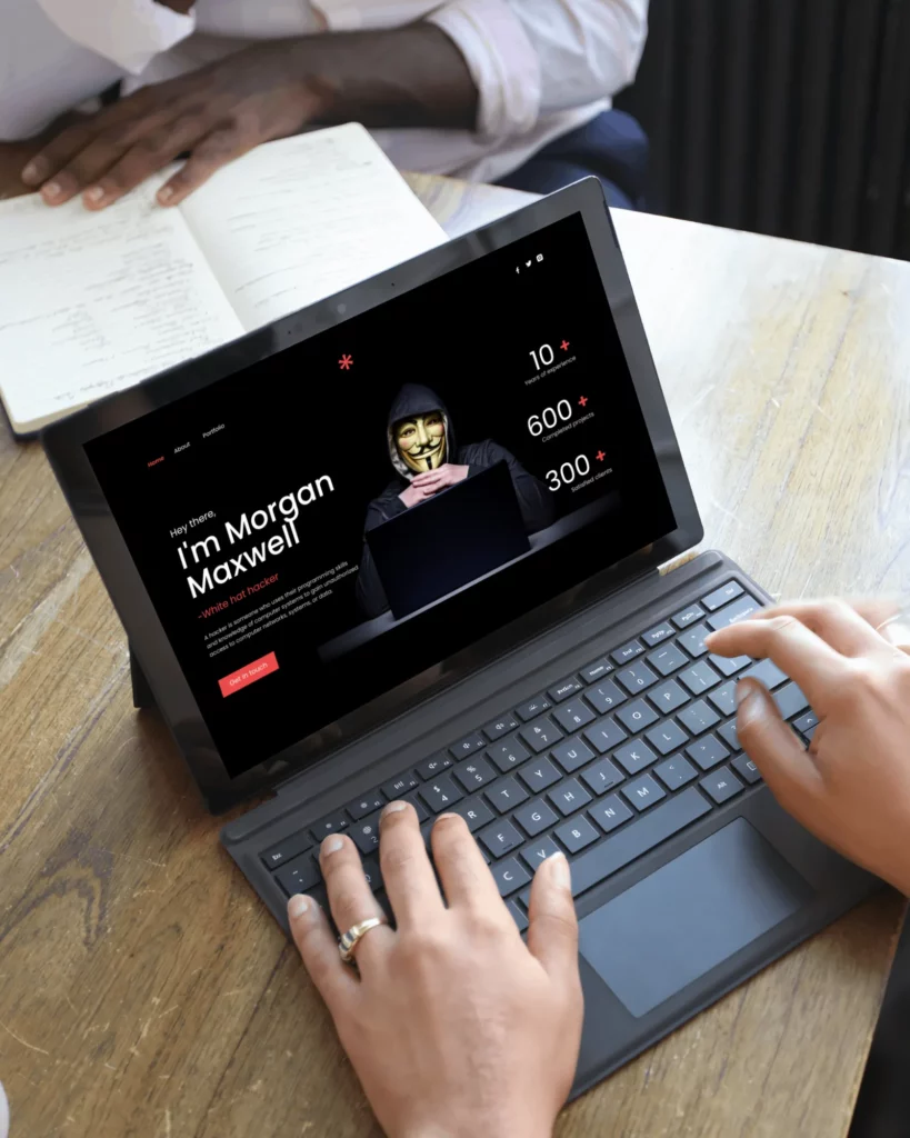 young man using his hp laptop on an outdoor table