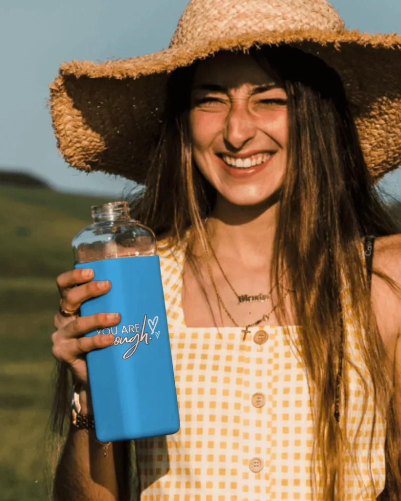 a women holding bottle mockup