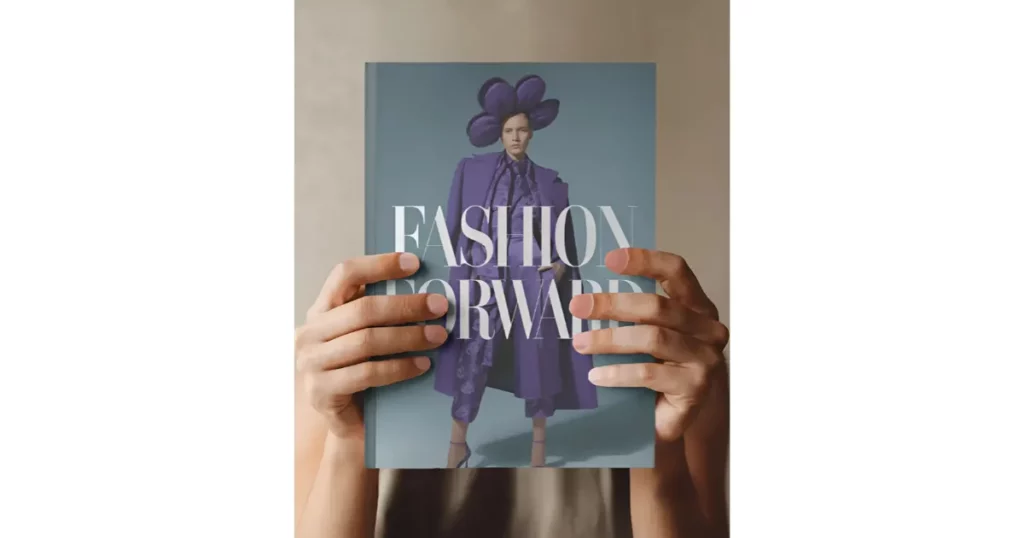 a portrait magazine held by two steady hands