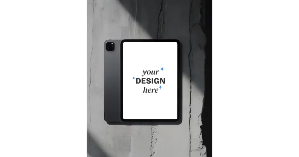 an ipad pro sits on a concrete