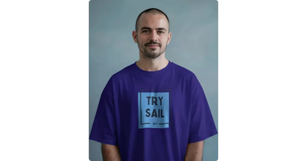 a bald man standing straight wearing a t-shirt
