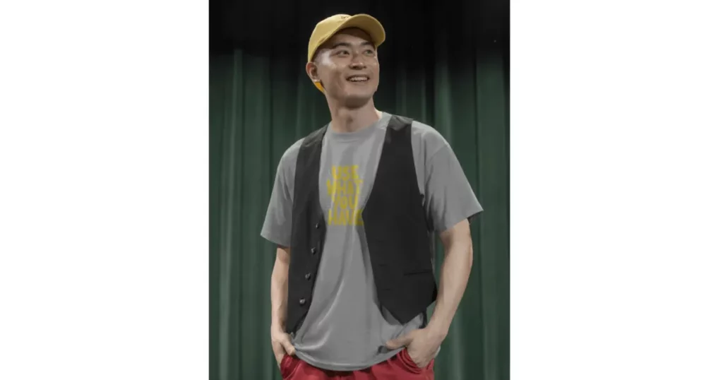 a black buttoned vest with an oversized t-shirt