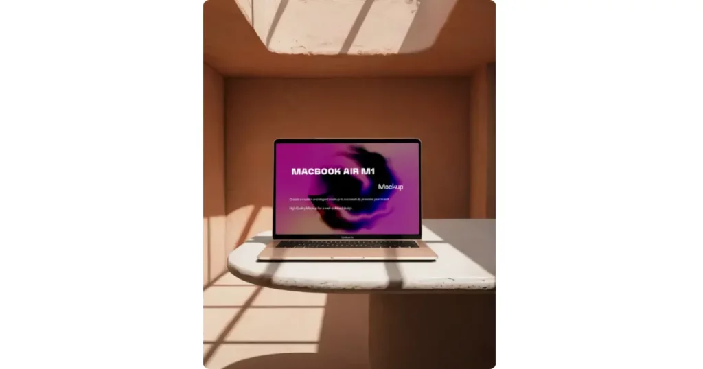 a macbook air m1 on a marble surface