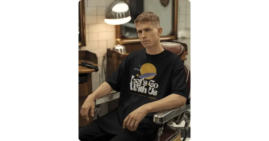 a man wears a t-shirt in a barber shop