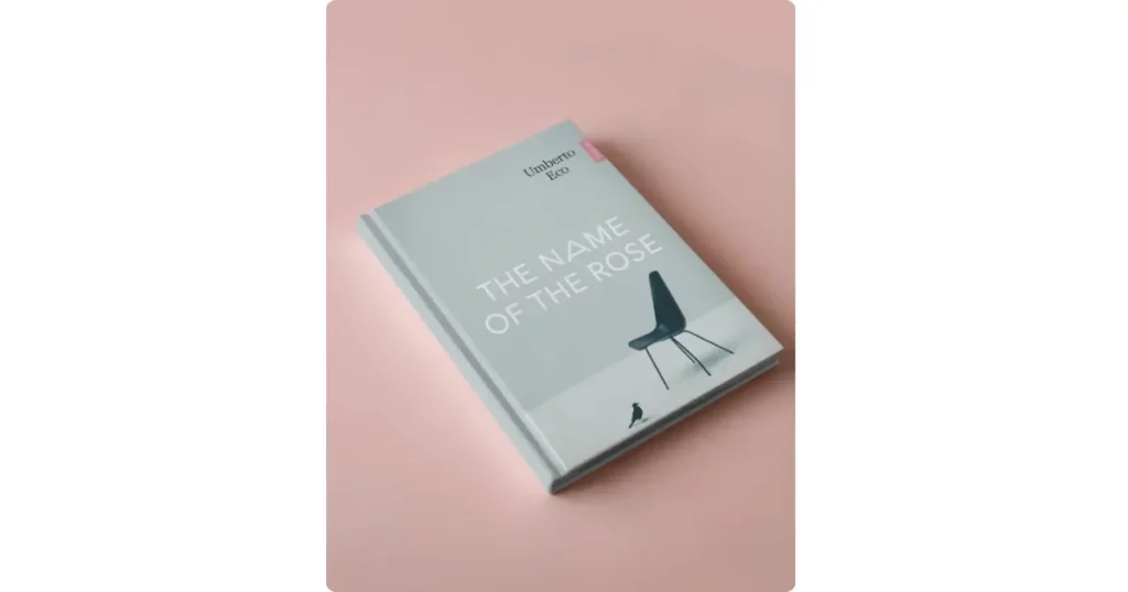 the a4 book rests on a pink surface