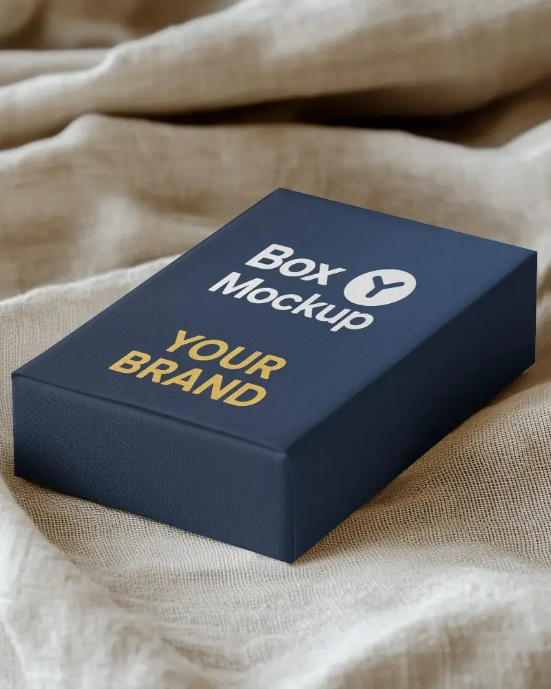 textured box mockup on linen fabric soft lighting premium packaging display