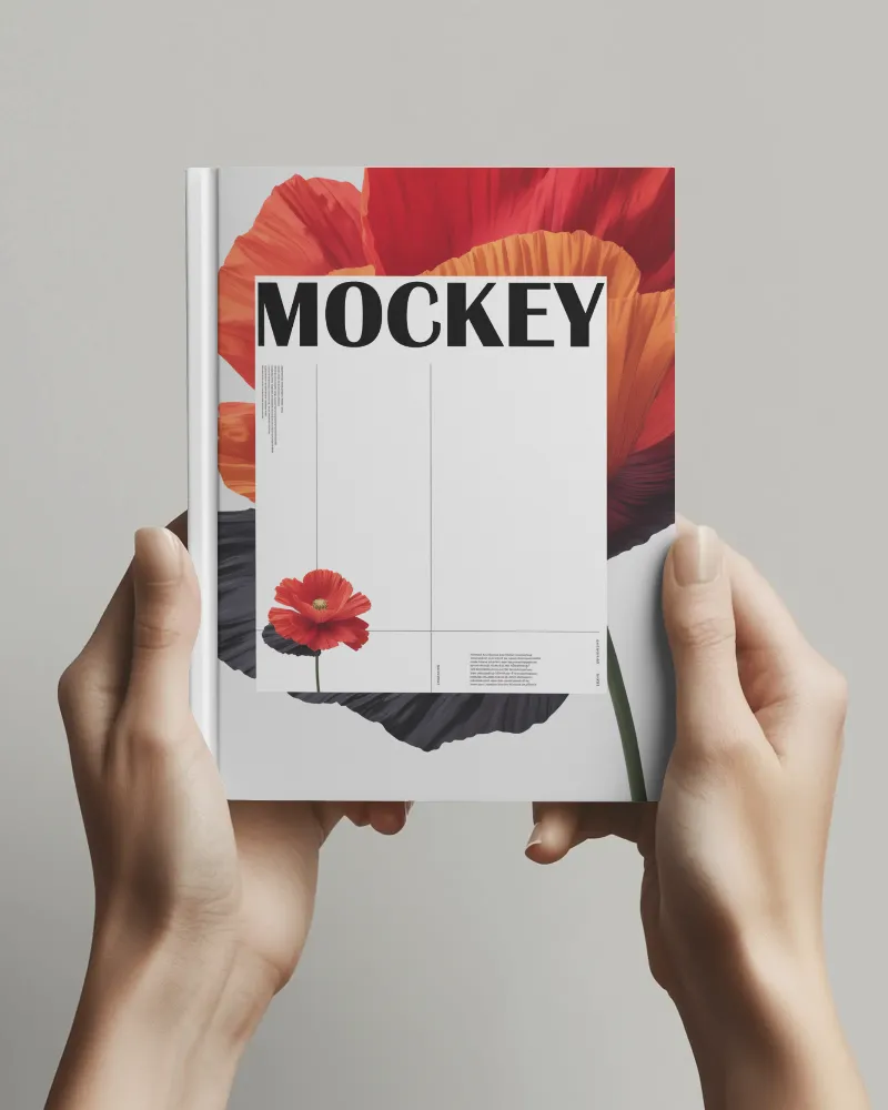 hand holding hardcover book mockup