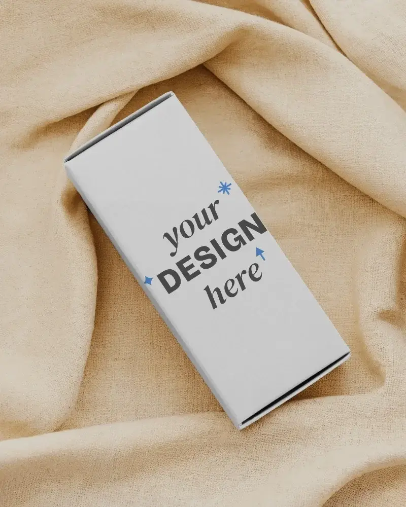 rectangular box mockup resting on wrinkled beige cloth top angle soft light