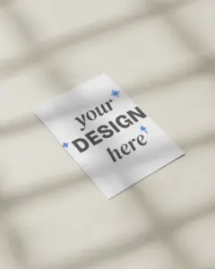 minimal top view flyer mockup on cream surface with soft window shadows and daylight