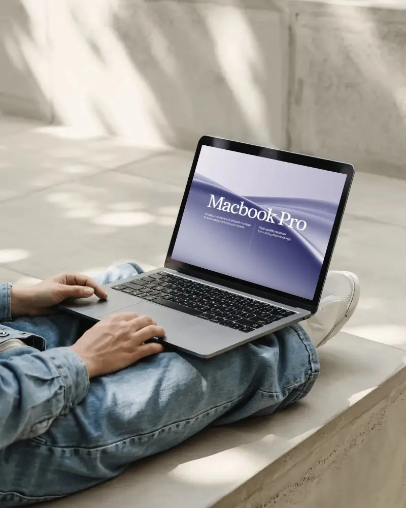 Hand Holding MacBook Mockups