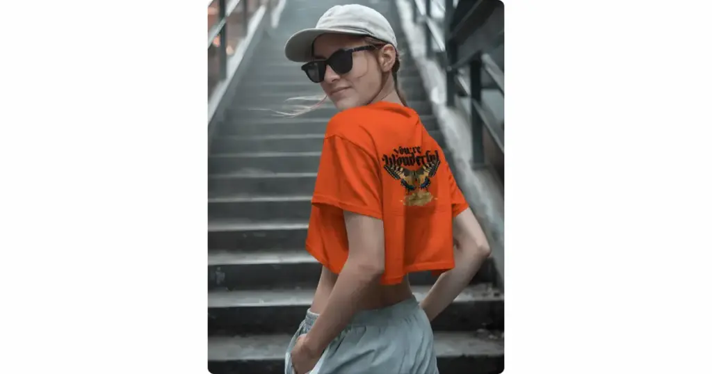 a model showing back view of the crop top standing against a staircase