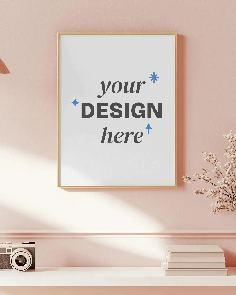 pastel living room poster mockup soft pink wall and natural lighting with vintage camera and books cozy and aesthetic