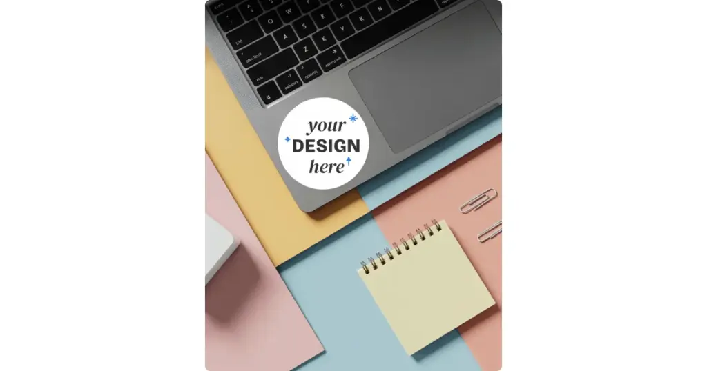 A sticker on a laptop is placed on a table