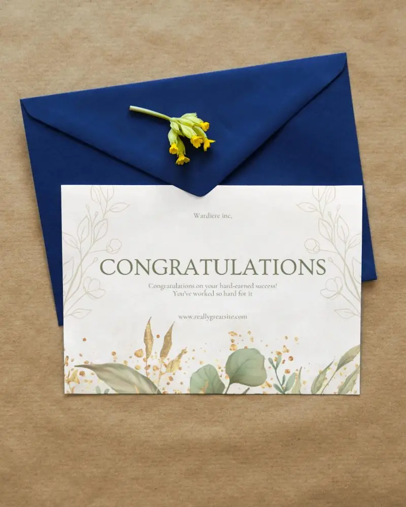 greeting card mockup enclosed in an envelope with flower lying on it