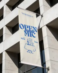 vertical outdoor banner mockup hanging on modern building for advertising promo display