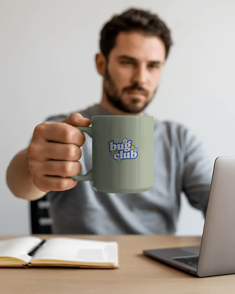 11oz ceramic mug mockup held by hand
